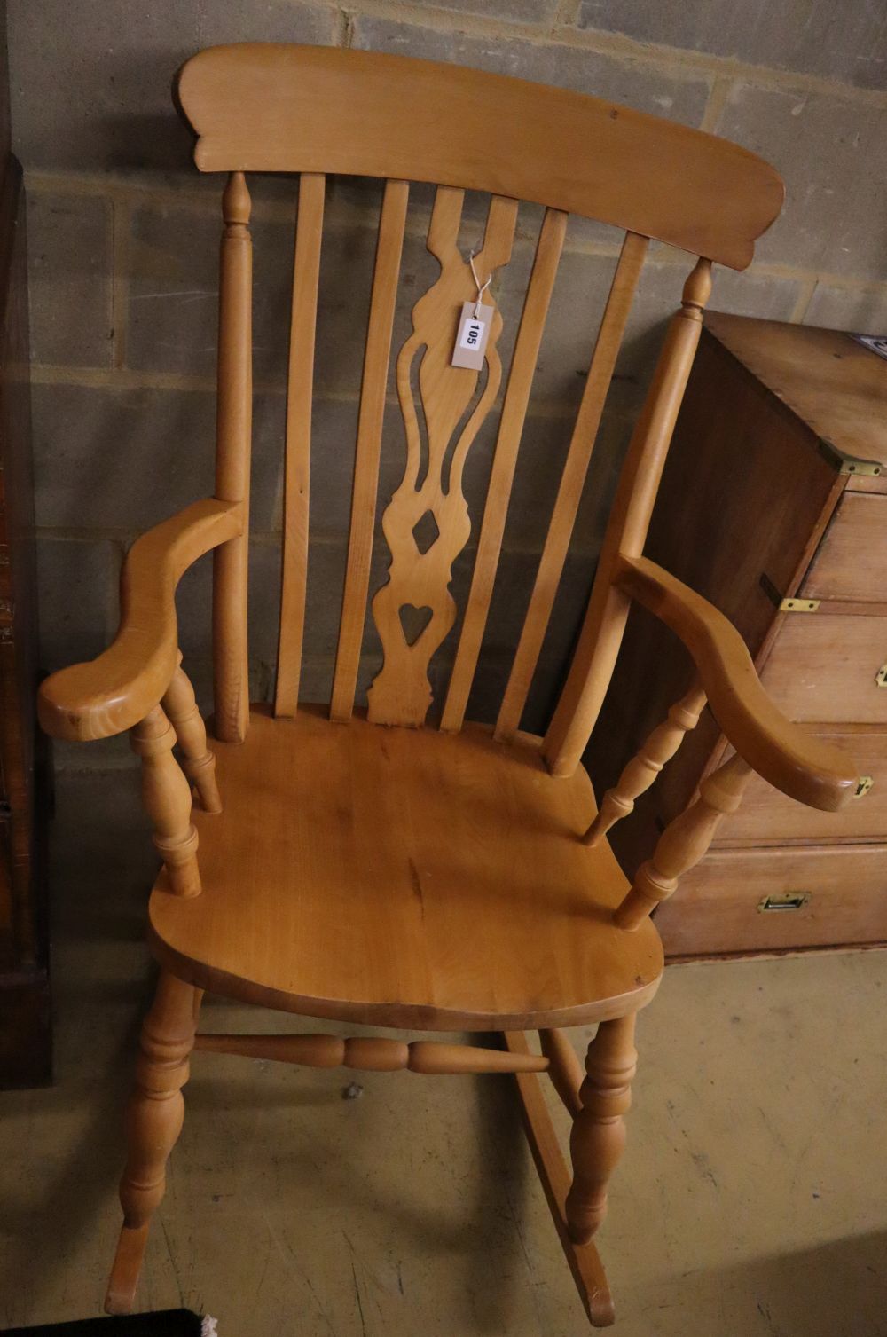 A pine and beech Windsor rocking chair